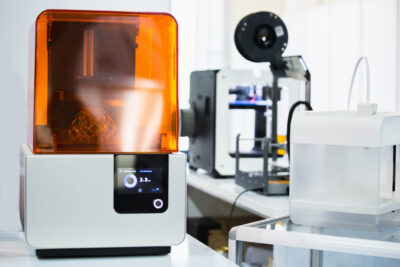 A stereolithography 3d printer in the laboratory prints a struct